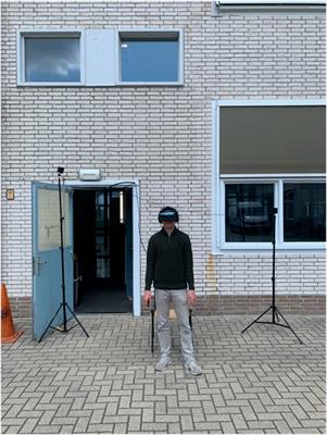 Augmented reality for supporting the interaction between pedestrians and automated vehicles: an experimental outdoor study